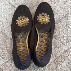 Rothy's Black Flats with Gold Floral Design